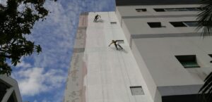 Waterproofing treatment works to external wall with rope access technician