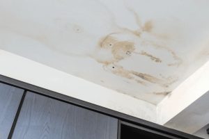 Brown ceiling water stain from a ceiling leak in a Singapore HDB flat