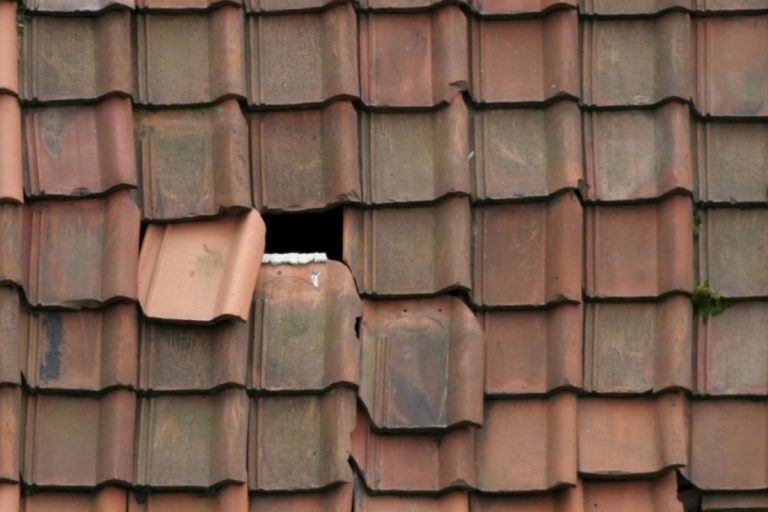 Slipped or dislodged roof tiles