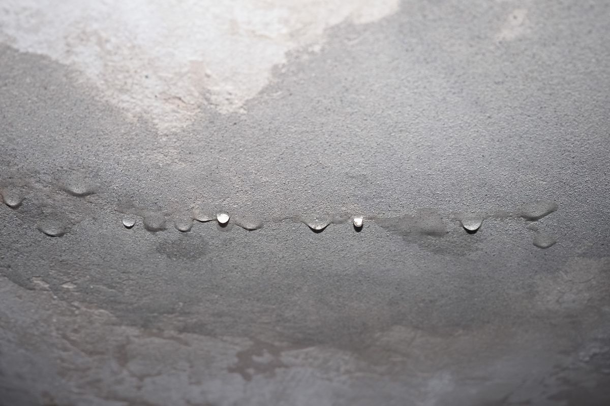 Water seepage in a Singapore wall showing a damp patch and peeling paint